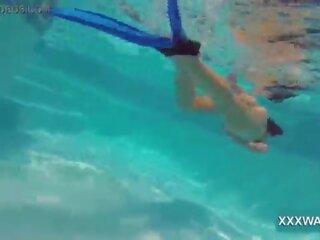Superior brunette street girl Candy swims underwater